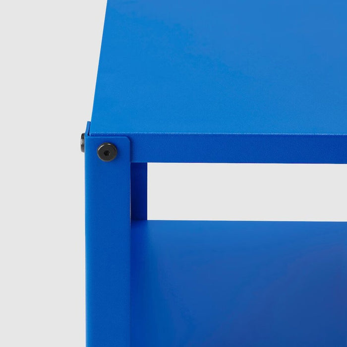 Close-up view of a bright blue bedside table  20564135