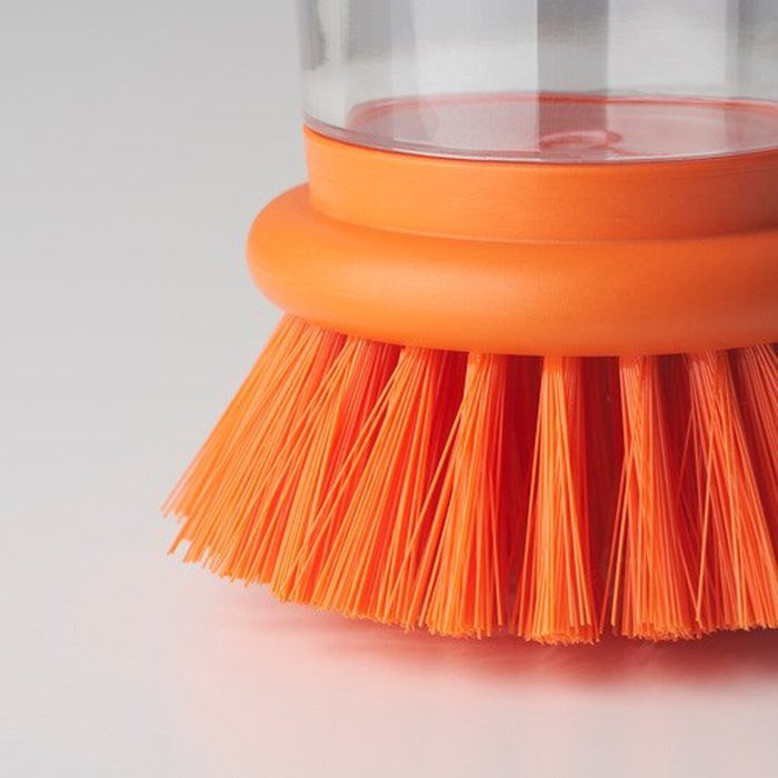 Close-up of the bright orange dishwashing brush with built-in dispenser from IKEA  30561023
