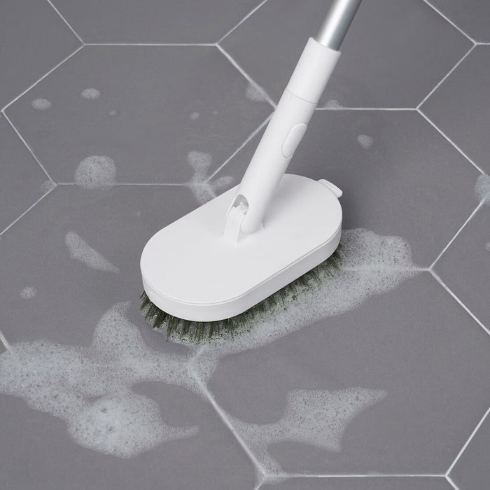 Versatile green cleaning brush head for multiple surfaces
