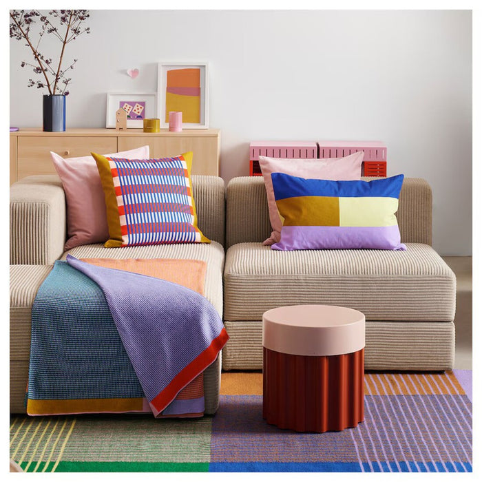 Soft and lightweight throw blanket with a vibrant mix of colors from IKEA