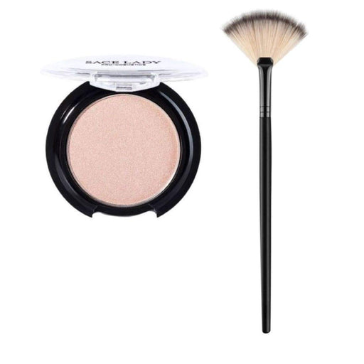 Close-up of SACE LADY Highlighter Powder and Brush set. The highlighter powder is a shimmery, gold-toned powder in a compact with a mirror. The brush is a small, angled brush with soft bristles."