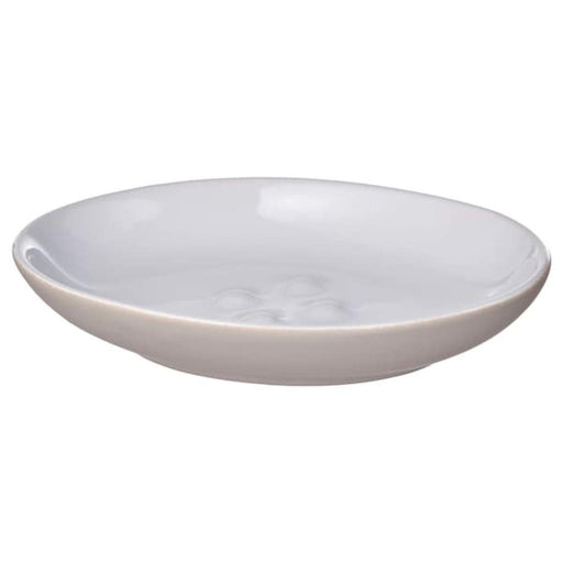 A white stoneware soap dish from IKEA with curved edges and a smooth surface. 00493002