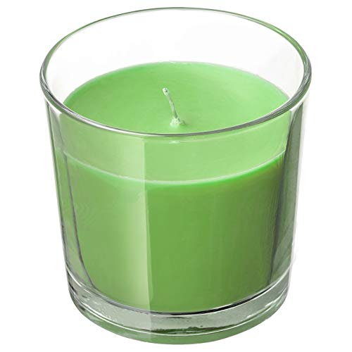 IKEA scented candle in a glass jar with natural elements, perfect for creating a cozy and inviting ambiance in any room.
