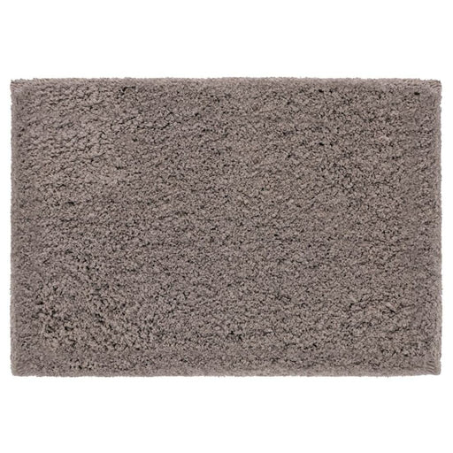Beige bath mat from IKEA with plush texture and anti-slip backing for added safety and comfort 00489420