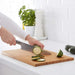 A chef's essential tool, an IKEA bamboo chopping board in a large size for heavy-duty use.-20233428