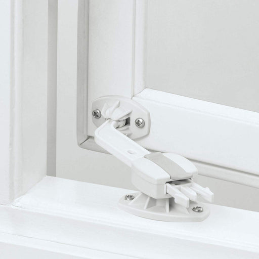 The IKEA Window Catch - Pack of 2 installed on a window with a view of the outdoors