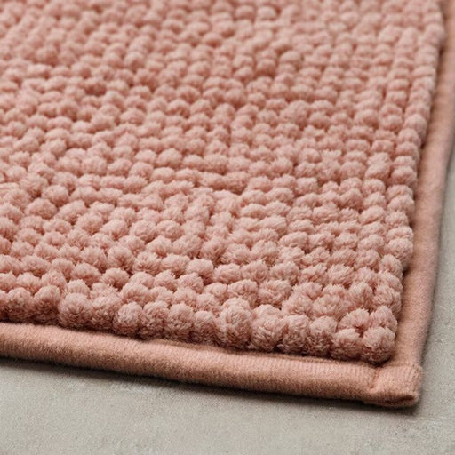 Thick and luxurious pink bath mat from IKEA, with a plush texture that provides comfort and warmth to your feet after a shower or bath 90517027