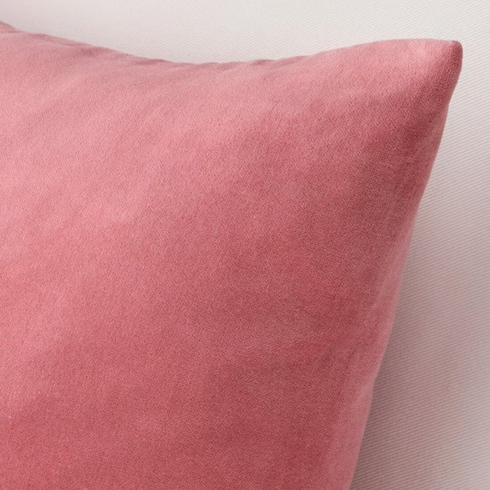 A close-up shot of an Ikea cushion cover in a vibrant dark pink color 50x50 cm 30516455