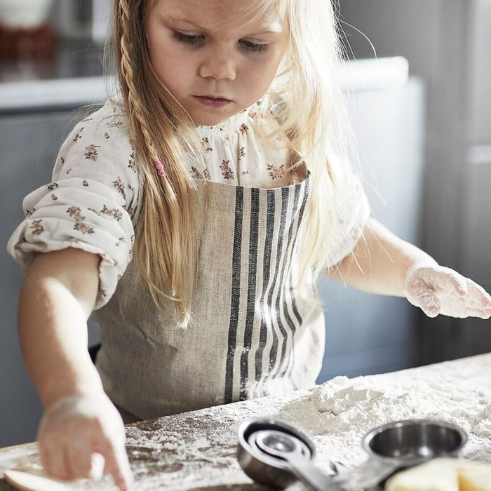 Encourage your child's love of cooking and baking with this functional and cute apron from IKEA, perfect for messy kitchen adventures 10479581