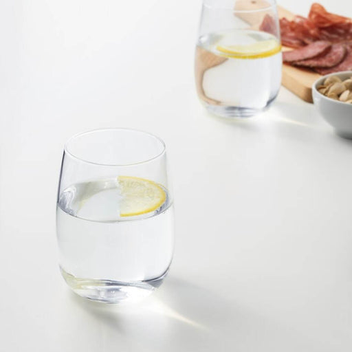 Digital Shoppy ikea glass 60396282, An overhead shot of a set of clear glasses from IKEA, each with a 37 cl capacity, arranged neatly on a table, ready to be used for a dinner party 