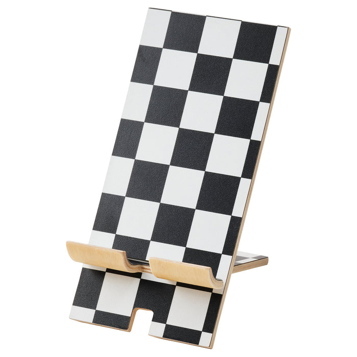 IKEA PLUGGLAND mobile phone holder black white check pattern on desk #10518827