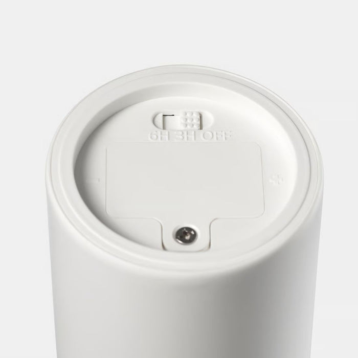 Close-up of SMÅLOM base showing 6H/3H/OFF timer switch and battery compartment for easy operation