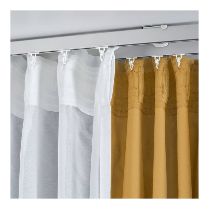 White and mustard yellow striped curtains on a rod with white hooks.