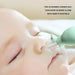 Close-up of baby using nasal aspirator with 15° curved tip, designed to align with infant nostrils for comfort