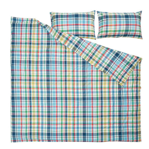 Plaid bedspread with two matching pillows on a white background