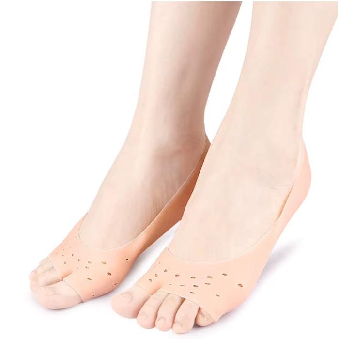  skin‑coloured silicone foot sleeves worn on both feet for cushioning