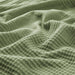 Close-up of IKEA INDIRA Bedspread in grey-green showing texture and pattern-80582626
