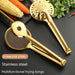 wo golden stainless steel frying tongs placed on a black surface—one with a mesh strainer and serrated edge, the other with circular perforations and raised grip bumps. The surrounding vegetables (corn, carrots, red chili, and cilantro) highlight their versatility.-1600003112384 13034149
