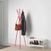 Close-up of IKEA EKRAR coat stand hooks holding jackets and bags in red finish
