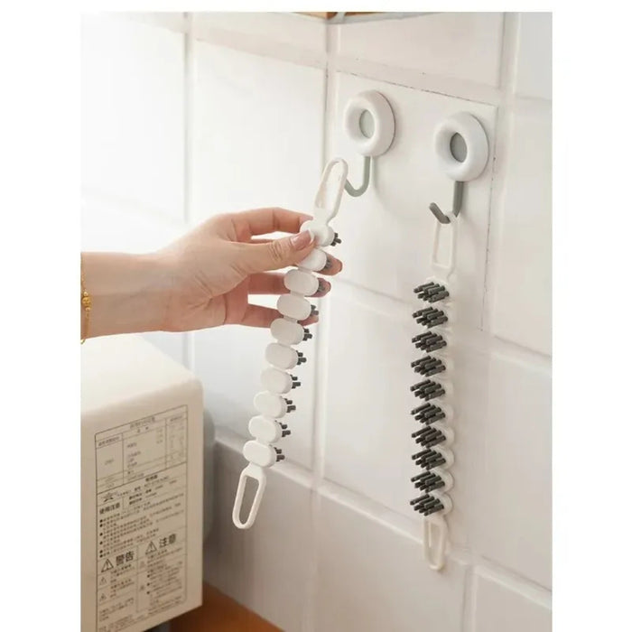 Flexible segmented cleaning brush shown in use and hanging on wall hook – designed for tile gaps and crevices – 1600001512507 13955116