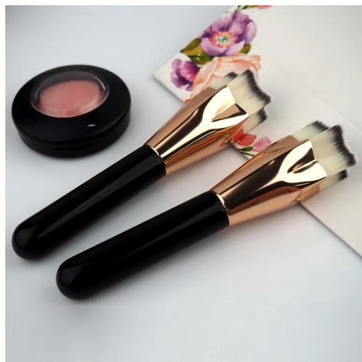 Digital Shoppy Two rose gold makeup brushes with compact blush container and floral card on flat surface
