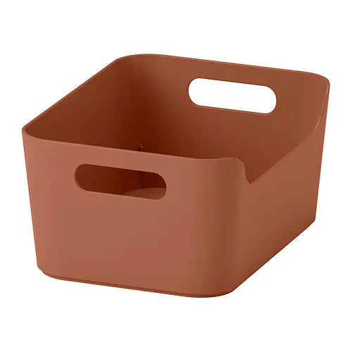 Brown storage basket with handles on a white background