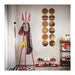 Close-up of IKEA EKRAR coat stand hooks holding jackets and bags in red finish