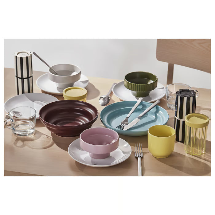 IKEA SPJUTLILJA whimsical stoneware dinnerware set styled on a wooden table