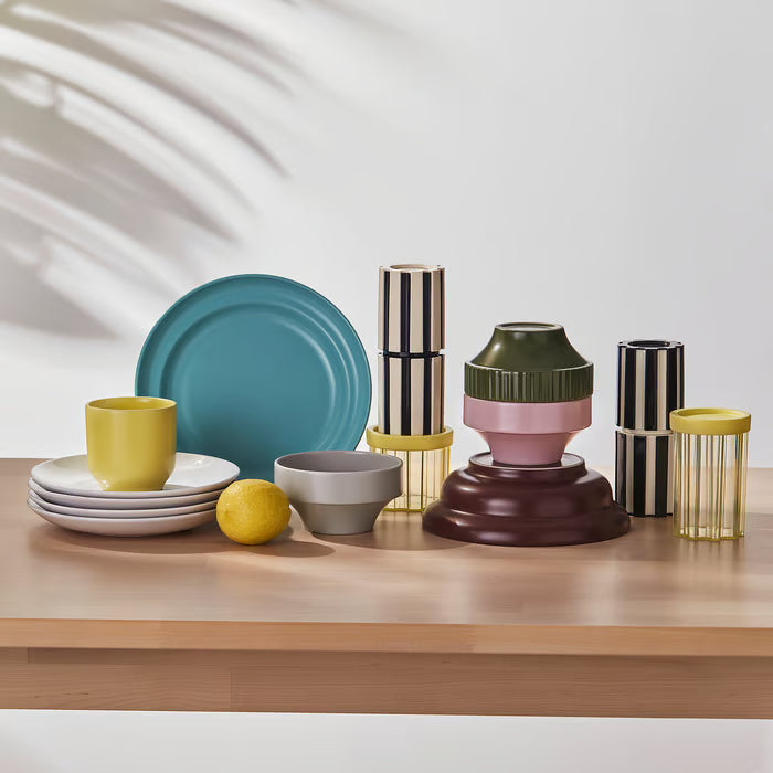 IKEA SPJUTLILJA side plates on a wooden table with colourful cups and vases bright table setting