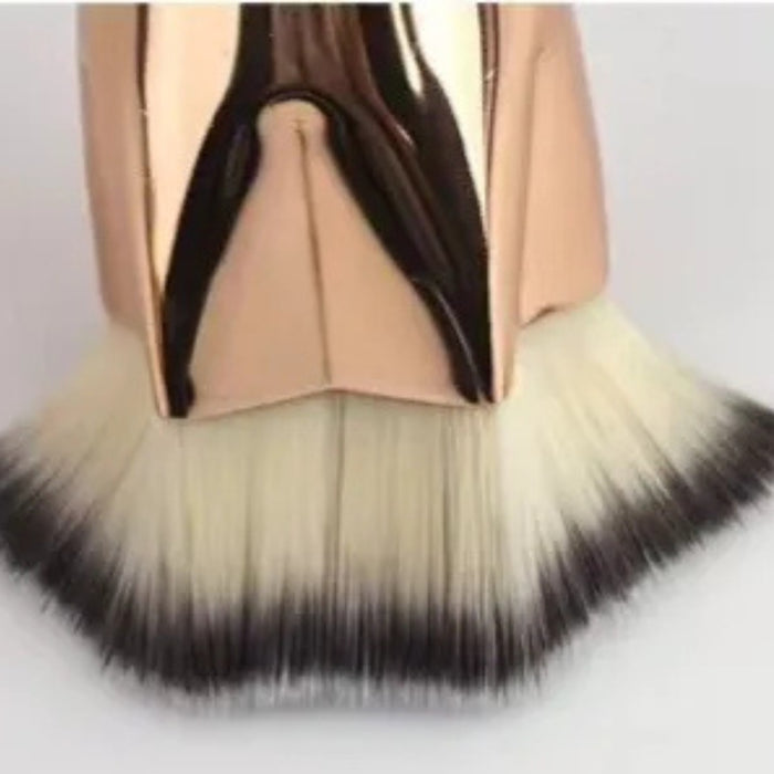 Digital Shoppy Close-up of rose gold makeup brush with fan-shaped gradient bristles