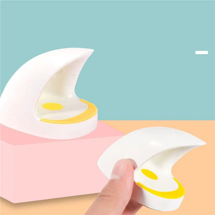 Crescent moon-shaped dessert with a hand holding one of the crescent moons against a pastel background