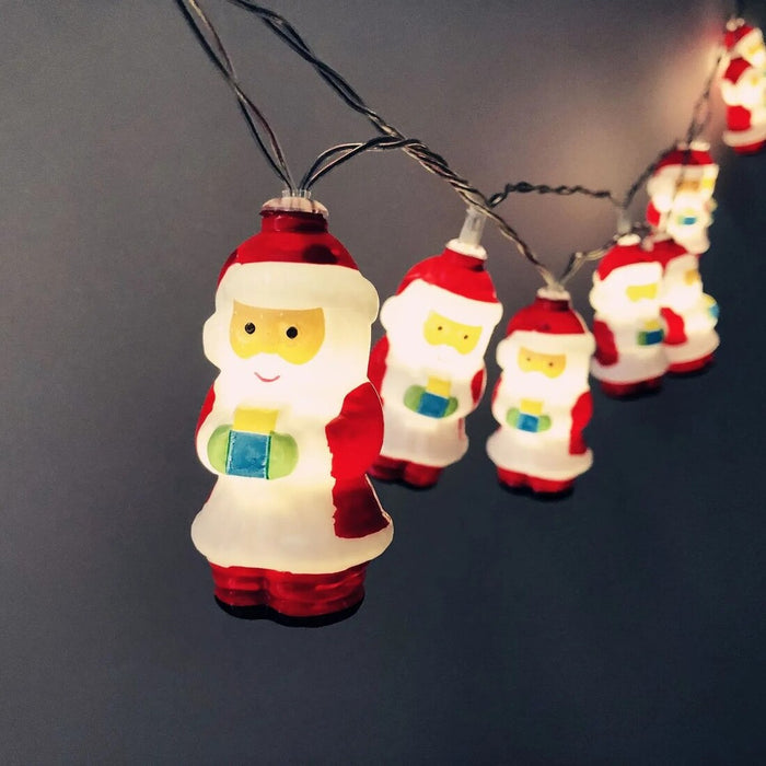 String of Santa Claus-shaped lights on a dark background