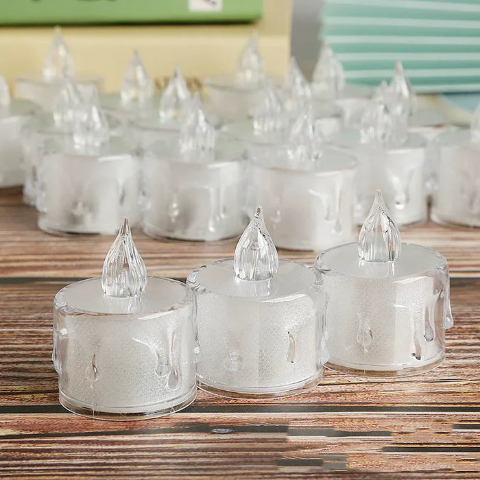 Clear plastic candles with small spires on a wooden surface
