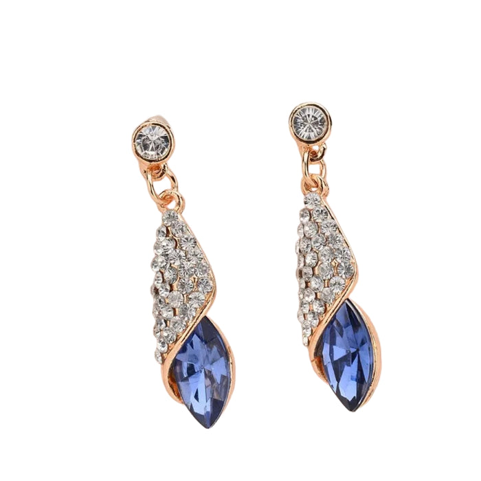 Pair of earrings with blue gemstones and rose gold accents on a white background