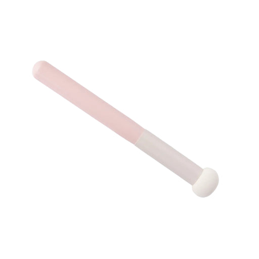 Pink and white makeup brush on a white background