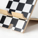 Close-up of IKEA PLUGGLAND mobile holder showing the graphic check pattern