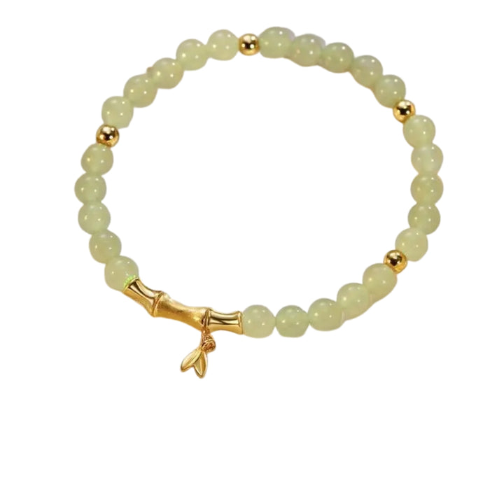 Beaded bracelet with gold accents on a white background