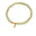 Beaded bracelet with gold accents on a white background
