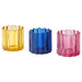 Three colorful glass candle holders on a white background