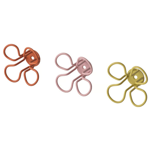 Set of three IKEA OMMJÄNGE wall hooks in diverse geometric shapes and vibrant colors like green, red, and blue.