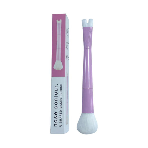 Purple nose contour makeup brush with packaging on a white background