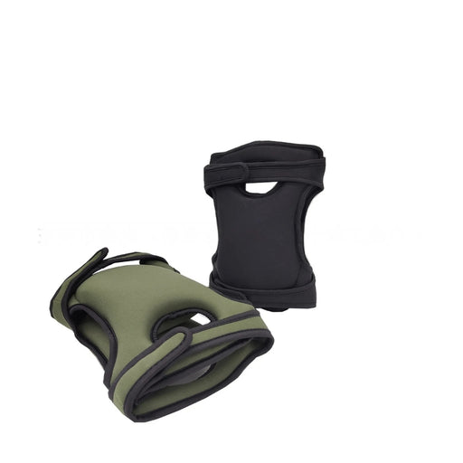 Two dog vests, one green and one black, on a white background