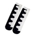 Pair of black and white wave-patterned socks laid flat with mirrored design