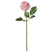 Pink artificial rose with green leaves on a white background