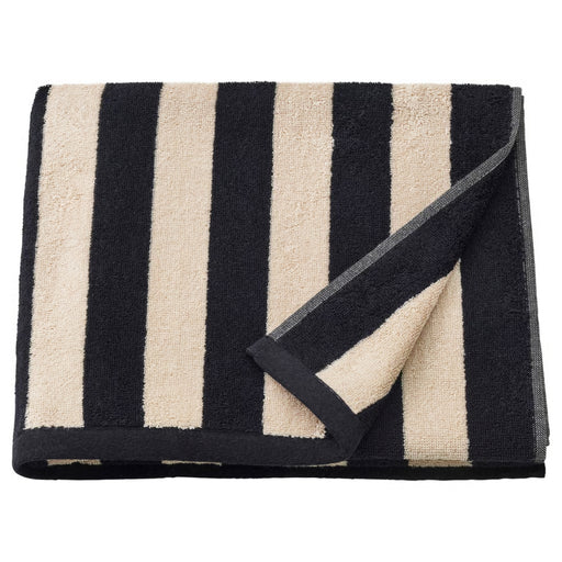 Black and beige striped towel on a white background