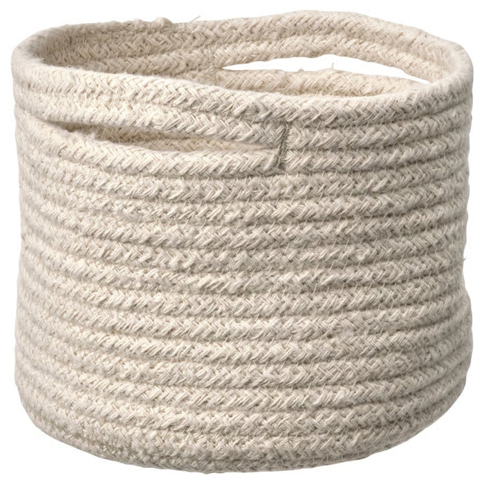 Beige woven basket on a white background