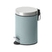 Light blue trash can with a silver lid on a white background