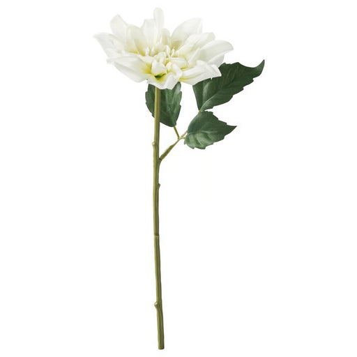 White artificial flower with green leaves on a white background