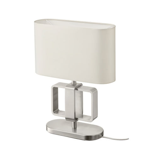 Table lamp with a white shade and metallic base on a white background