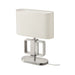 Table lamp with a white shade and metallic base on a white background
